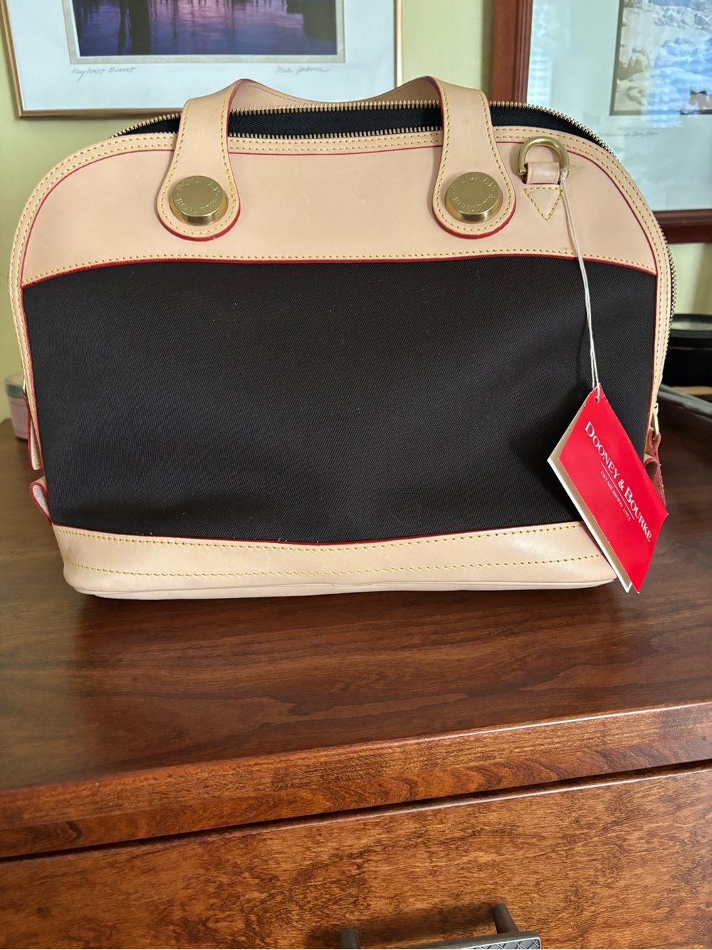 Dooney & Bourke brown cabriolet bag with tan leather. New with tags.